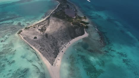 Tropical-Cayo-de-Agua-Island,-aerial-top-view-tilt-up-reveal-paradise-on-Earth