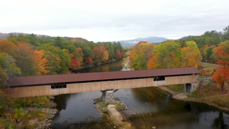 Aerial-shot-of-covered-bridge-in-New-England-during-peak-foliage-in-the-White-Mountains-of-New-Hampshire