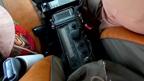 View-of-a-communication-radio-installed-in-a-4x4-safari-vehicle-while-driving