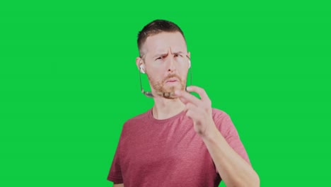 Surprised-and-confused-facial-expression-of-white-man-wearing-specks,-isolated-on-green-screen