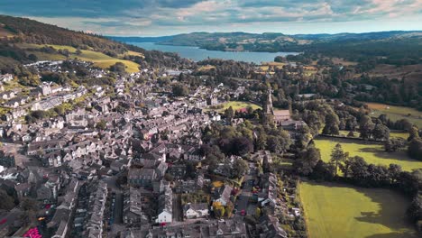 Aerial-drone-footage-of-Ambleside,-a-small-village-town-on-the-banks-of-Lake-Windermere,-Lake-District,-England