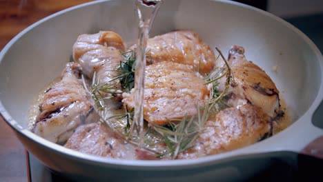 Pouring-Wine-into-a-Pan-Fried-Chicken-Dish-in-a-Skillet