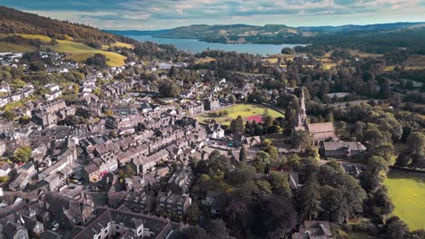 Aerial-drone-footage-of-Ambleside,-a-small-town-in-the-Lake-District,-has-now-become-a-major-tourist-resort-with-shops,-restaurants