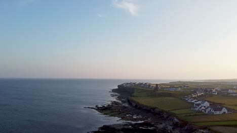 Drone-footage-of-Liscannor-fishing-village,-on-the-way-to-Cliffs-of-Mohor-showing-coastal-erosion