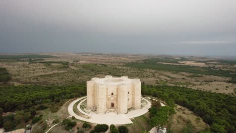 Drone-flying-in-large-circulair-motion-around-Castel-del-Monte-in-the-early-morning-in-the-south-of-Italy-in-4k