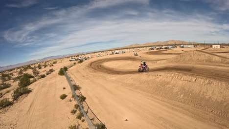 Motorcyclist-takes-a-huge-jump-on-a-dirt-racecourse---first-person-view-drone-in-slow-motion