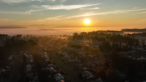 Wide-aerial-view-of-a-Whidbey-Island-neighborhood-underneath-a-foggy-sunrise