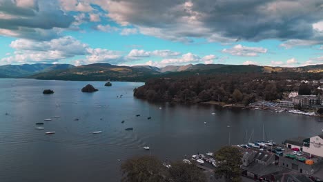 Lake-District-aerial-scene-showing-lake-Windermere,-woodlands,-hills,-fells,-boats,-and-reflective-water