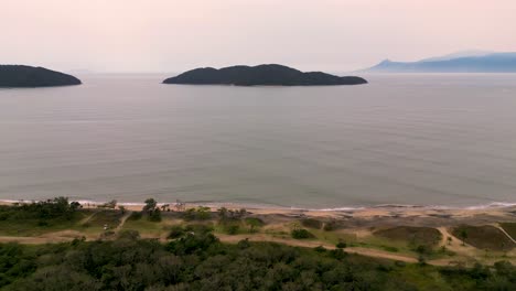 aerial-view-of-an-island-in-the-middle-of-the-sea---Ubatuba,-Brazil