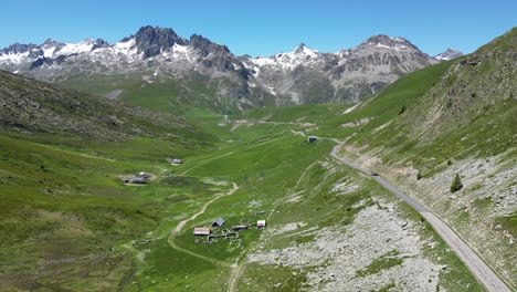 Scenic-Road-Col-de-la-Croix-de-Fer-in-Savoy-Isere,-French-Alps---Aerial-Dolly-Forward