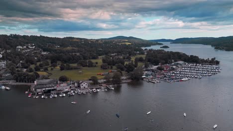 Lake-District-aerial-scene-showing-lake-Windermere,-moody-sky's-woodlands,-hills,-fells,-boats,-and-reflective-water