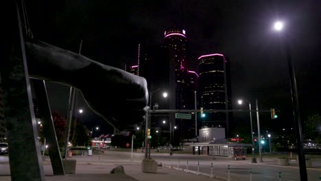 Joe-Louis-fist-statue-in-Detroit,-Michigan-with-gimbal-video-walking-forward-sideview-at-night