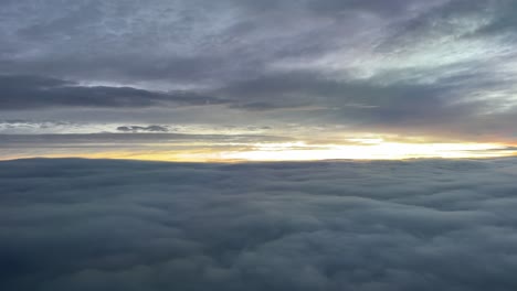 Aerial-view-while-flying-through-a-cold-winter-sky-at-dawn
