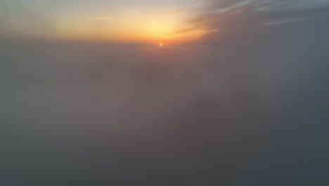 Flying-through-clouds-towards-the-sunrise