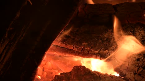fire-flame-close-up-of-burning-firewoods,-cold-heating-gas-supply-concept
