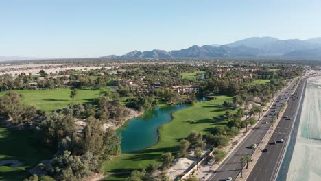Wide-aerial-shot-flying-over-a-vibrant-golf-resort-in-Palm-Desert