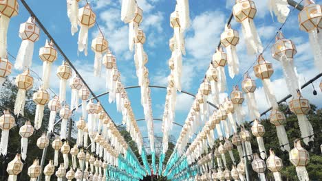 Low-angle-drone-flying-through-tunnel-full-of-typical-Loy-Krathong-Thai-lanterns