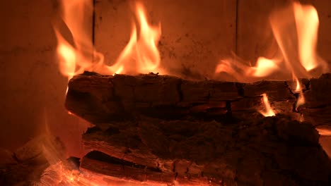 romantic-fireplace-during-xmas-Christmas-winter-holiday-extreme-close-up-of-burning-flame