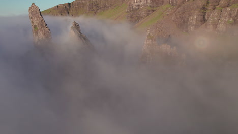 Flying-through-the-Old-Man-of-Storr-rock-formation-at-Isle-of-Skye,-Scotland