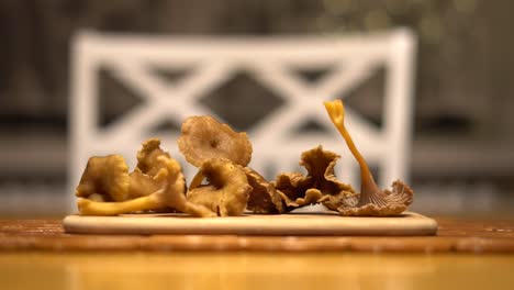 picking-up-tratkantarella-mushroom-from-the-table
