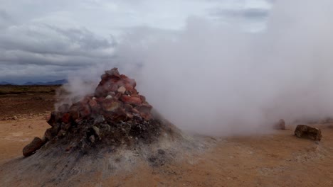 Large-fumarole-coming-out-of-the-rocks-very-quickly-and-without-pause-in-the-geothermal-region-of-Námaskarð,-in-Iceland