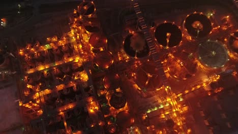 Drone-top-down-shot-of-metal-factory-at-night