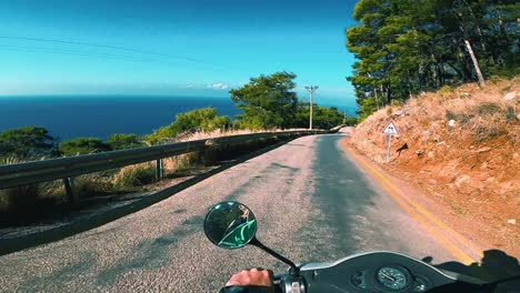 Driving-a-motorbike-on-a-scenic-road-in-the-mountain-with-a-sea-view---Kabak,-Turkey