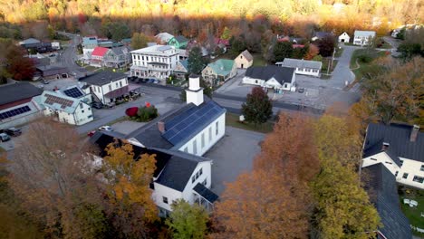 new-england-aerial-of-rochester-vermont-in-fall-with-autumn-leaves,-church-with-solar-panels