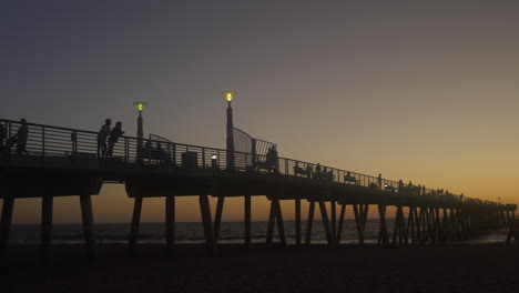 Wide-Shot-Silhouette-of-Hermosa-Pier-at-Sunset