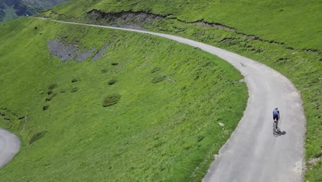 drone-aerial-view-following-a-single-cyclist-attacking-an-epic-incline-in-the-french-Pyrenees