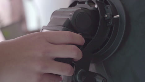 Closeup-View-Of-Pulling-External-Flash-Of-A-Camera-And-Putting-It-Back---Slowmo