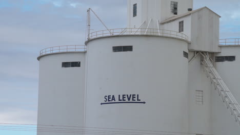 Sea-level-mark-on-sugar-factory-silo-in-Imperial-Valley,-California