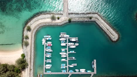 Aerial-top-down-view-of-Harbour-port-pier-with-Yachts-at-Tioman-island,-Malaysia