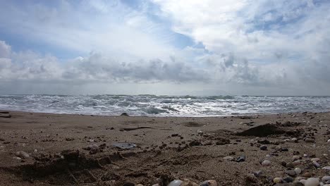 Sand-beach-and-sea-waves-with-blue-sky-and-white-clouds-footage