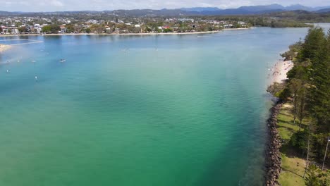 Clear-waters-of-the-Tallebudgera-Creek---Queensland-Australia---Aerial-descend