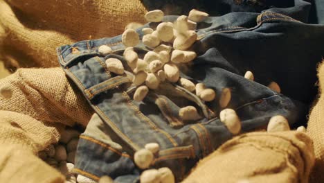 Slow-motion-stones-fall-on-jeans
