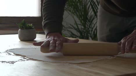 Making-home-made-pasta-rolling-dough-ingredients-in-kitchen