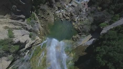 Cascading-Waterfall-Along-Steep-Cliff-Wall-at-Salt,-Girona,-Catalonia