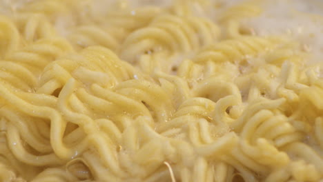 Macro-Shot-Of-A-Ramen-Noodles-On-A-Bubbling-And-Boiling-Water