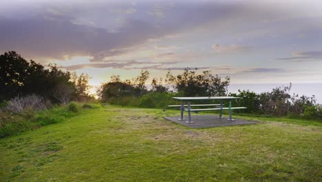 Empty-Picnic-Table-With-Scenic-View-Of-Ocean-During-Sunrise---Crescent-Head---Sydney,-New-South-Wales,-Australia