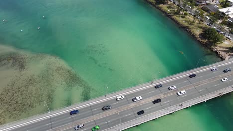 Cars-Travelling-At-The-Tallebudgera-Creek-Bridge-Over-The-Turquoise-Blue-Water---Gold-Coast,-Queensland,-Australia