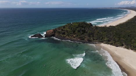 People-Surfing-At-Fingal-Head-Beach---Ocean-Waves-Splashing-At-Fingal-Head-Causeway---New-South-Wales,-Australia