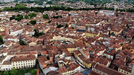 Beautiful-aerial-shot-of-Lucca-city,-an-ancient-town-in-the-middle-of-Tuscany,-Italy,-4K