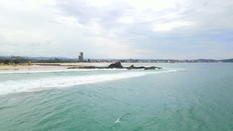 Foamy-White-Waves-Coming-On-Sandy-Shore-Of-Currumbin-Beach---Scene-Of-Beach-During-COVID-19-In-Currumbin,-QLD,-Australia