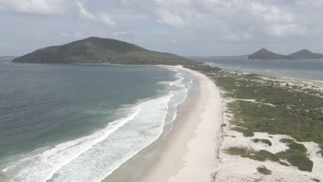 Aerial-View-Of-Waynderrabah-Beach-And-Mount-Yacaaba-At-Daytime---Headland-And-Tomaree-Mountain-In-Shoal-Bay-Near-Hawks-Nest,-NSW,-Australia