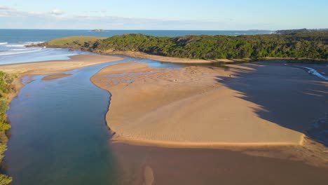Aerial-View-Of-People-At-Sandy-Moonee-Creek-With-Panorama-Of-Beach-And-Green-Bluff-Headland---Moonee-Beach-In-NSW,-Australia