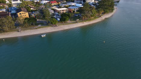 Waterfront-Houses-At-Tallebudgera-Creek-In-Gold-Coast,-Australia-With-Calm-Blue-Water