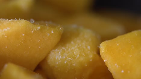 macro-close-up-shot-of-frozen-mango-cubes-in-kitchen