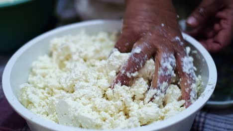 Traditionally-making-homemade-cheese-in-a-mountain-village