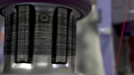 4K-clip-of-Industrial-machine-unwinding-nylon-spool-in-sock-making-process